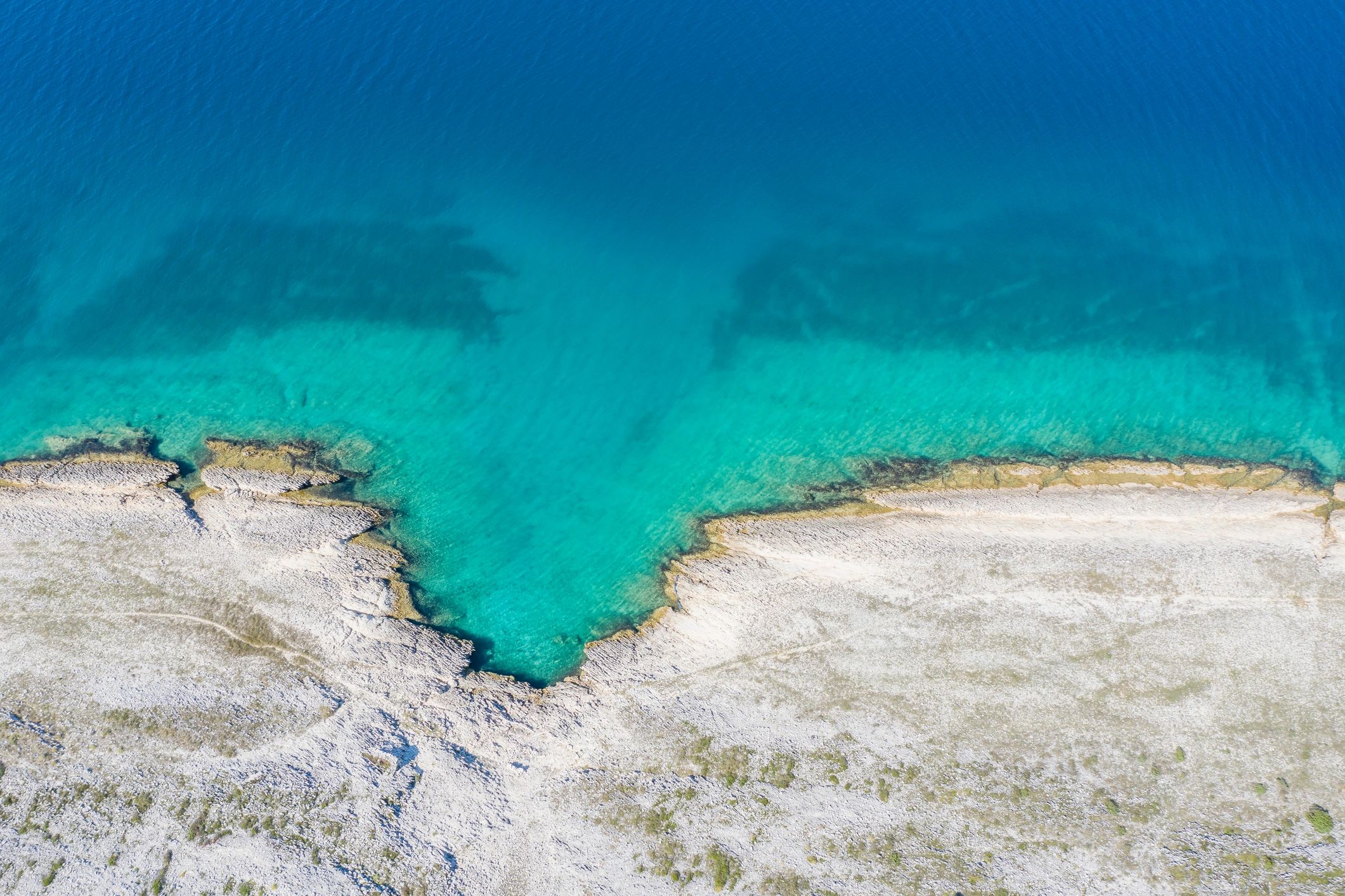 Aerial tropical coastline with vivid ocean colors