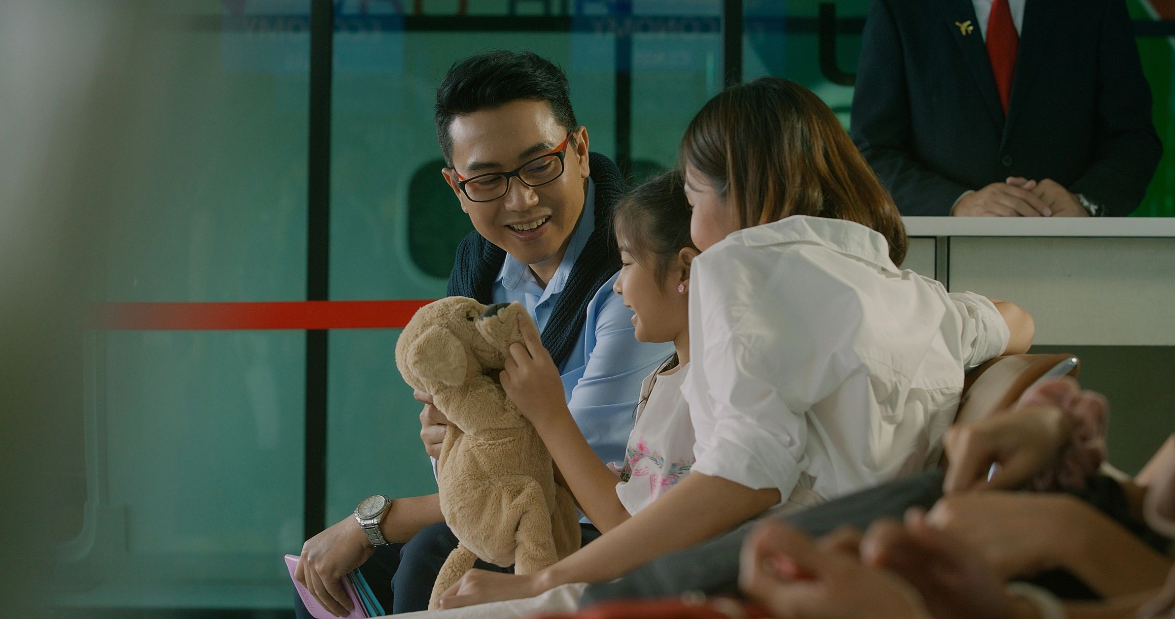 Travelers waiting at an airport gate before departure