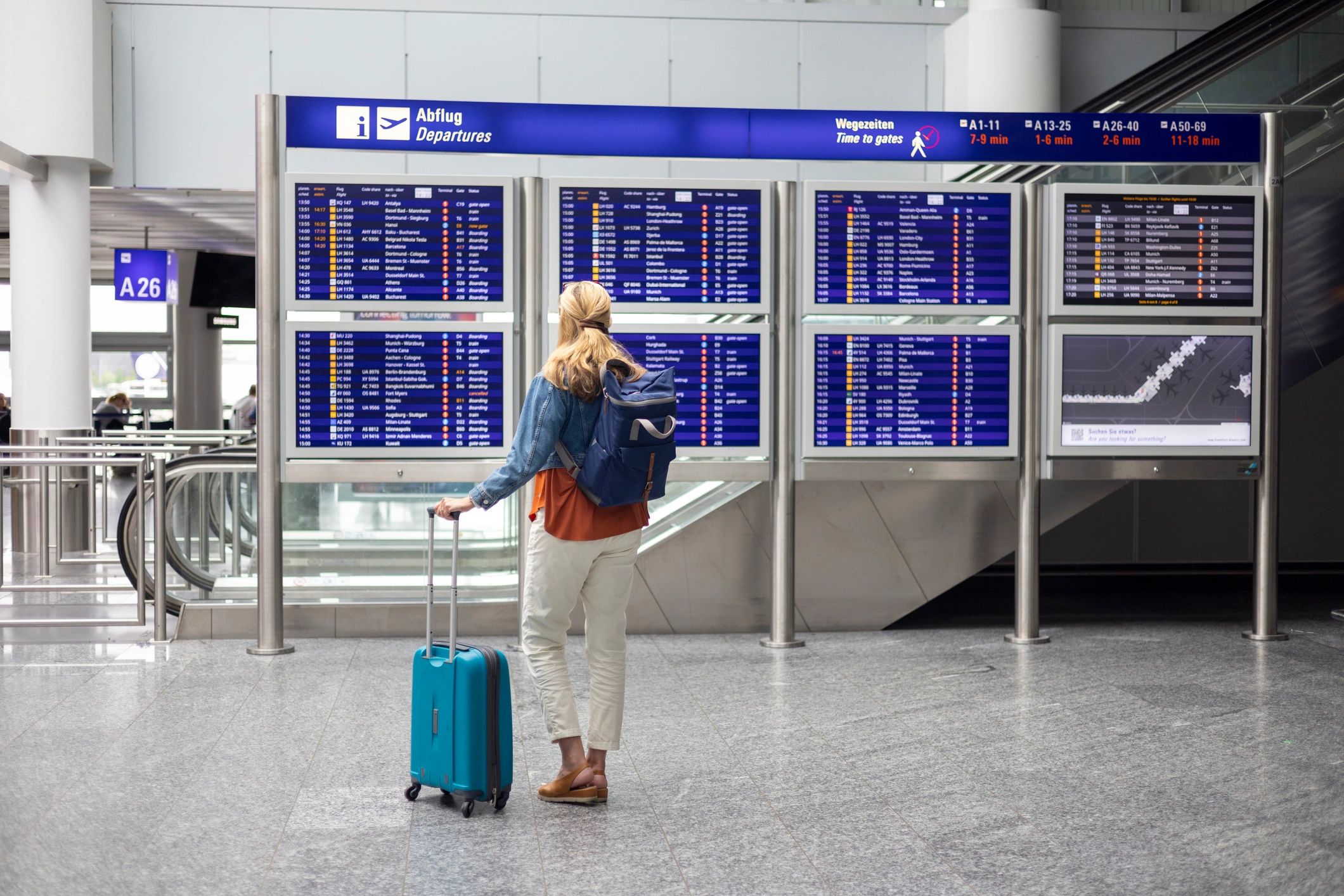 Traveler checking airport departures