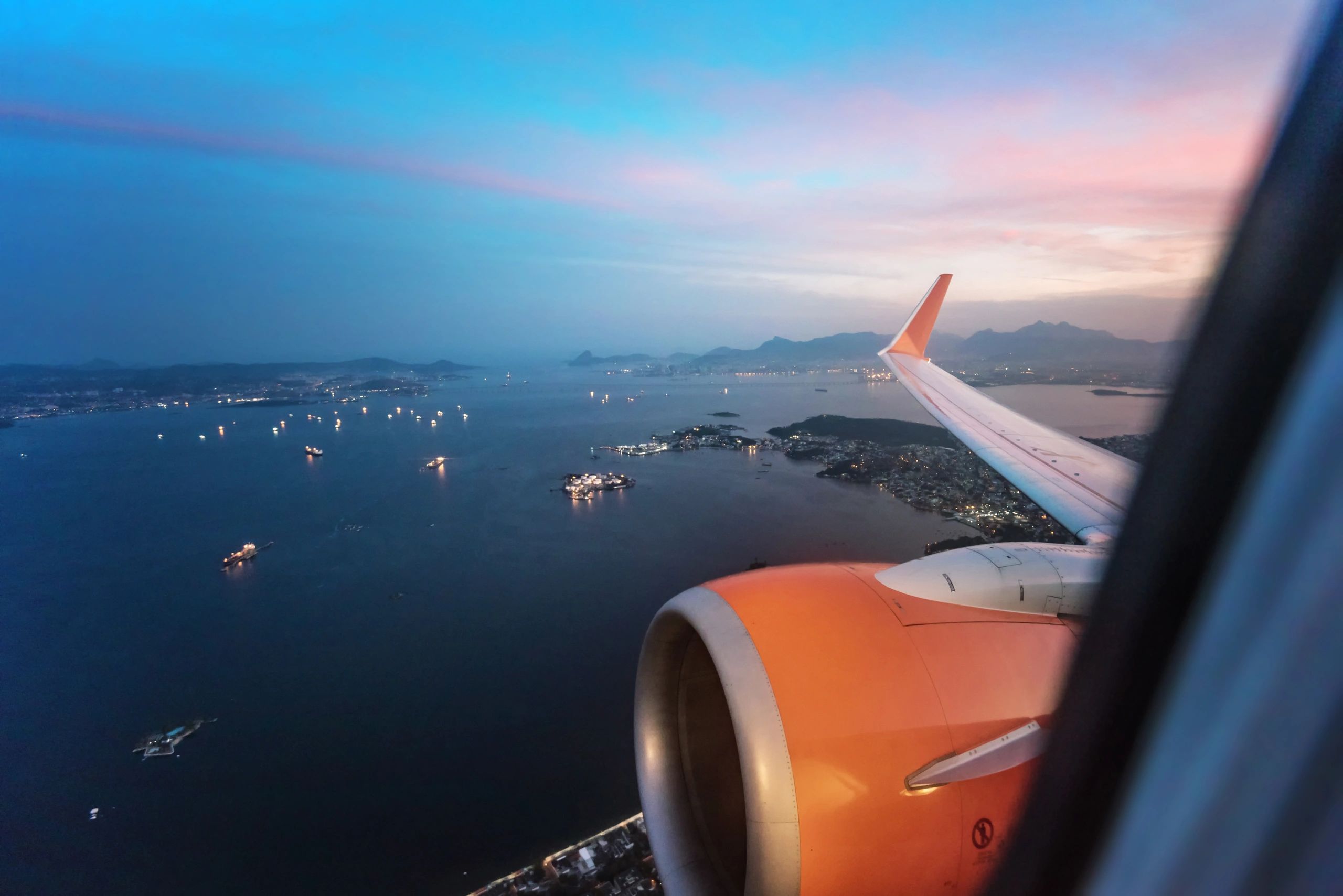 View from airplane window over tropical islands and ocean